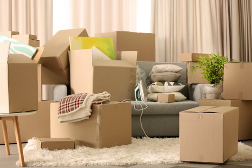Professional movers loading household items for a South West London move