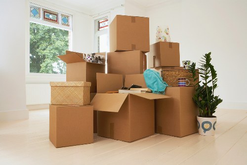 Packed boxes and furniture ready for transport in a Colliers Wood flat move